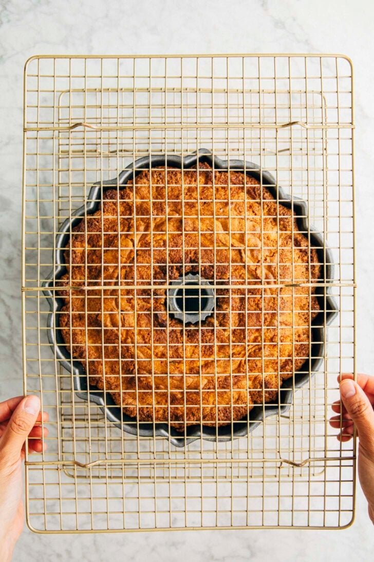 photo showing the first step in turning the cake out of the bundt pan
