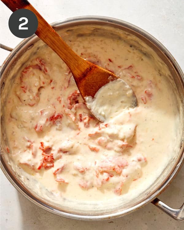 Smoked salmon pasta sauce cooking in a skillet. 