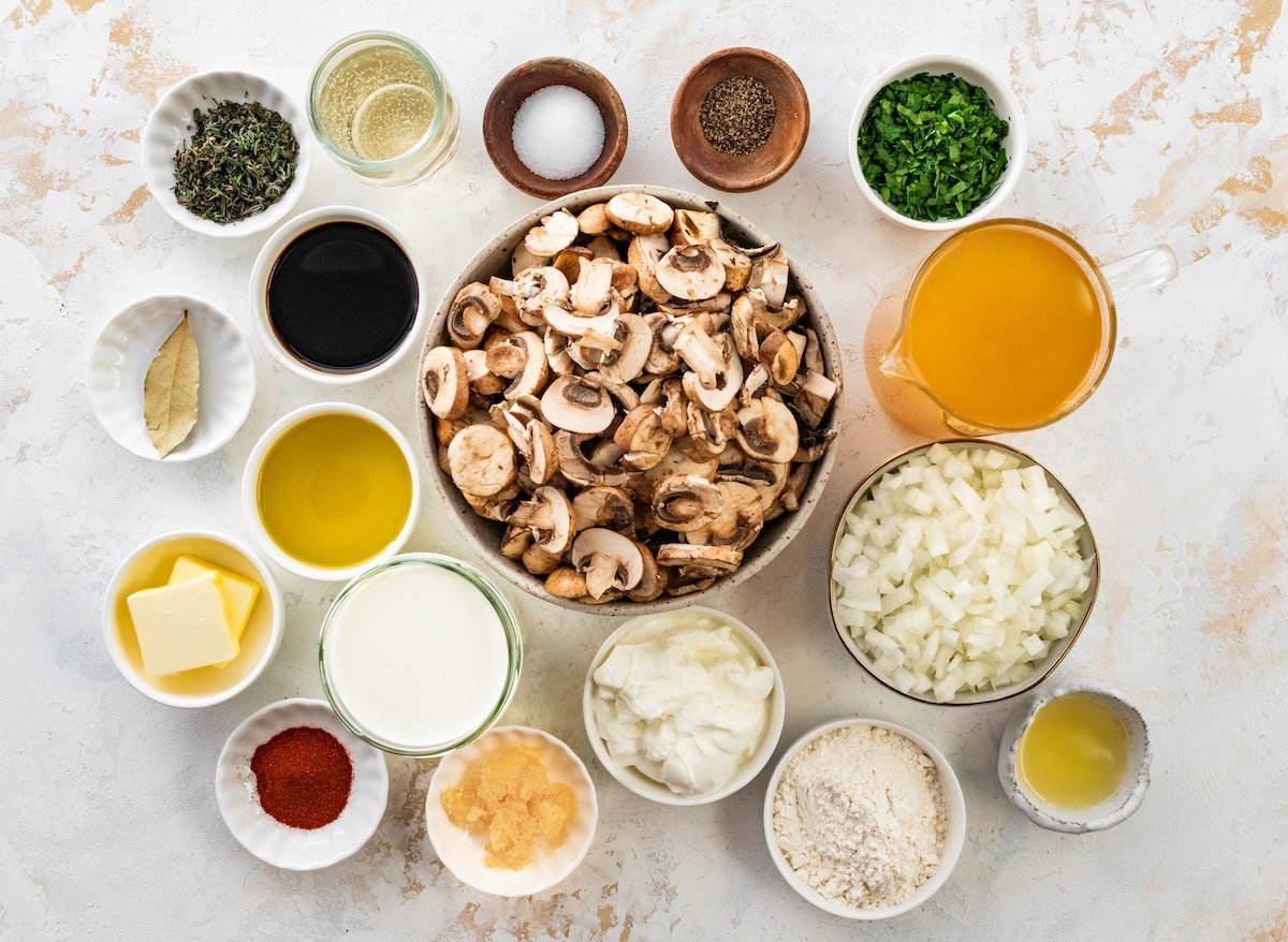 ingredients in bowls to make creamy mushroom soup.