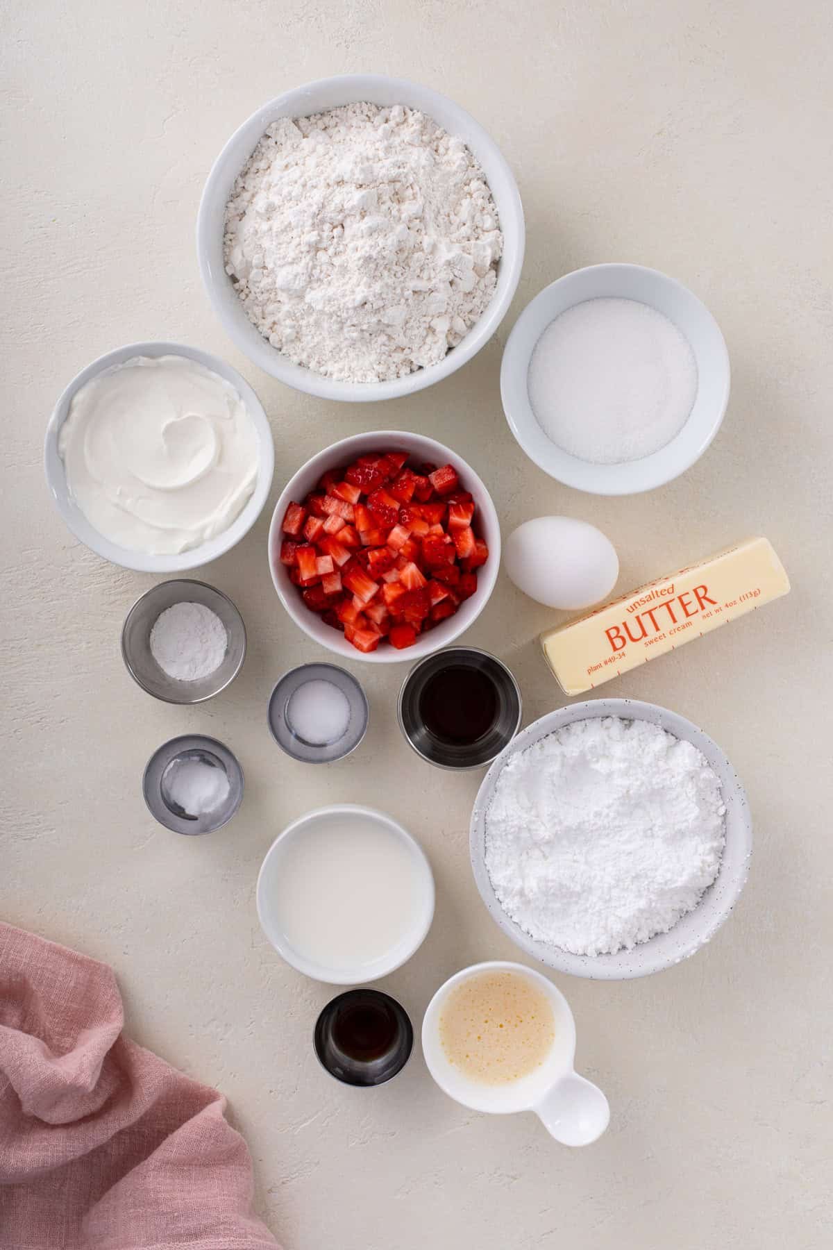 Ingredients for strawberry scones arranged on a countertop.