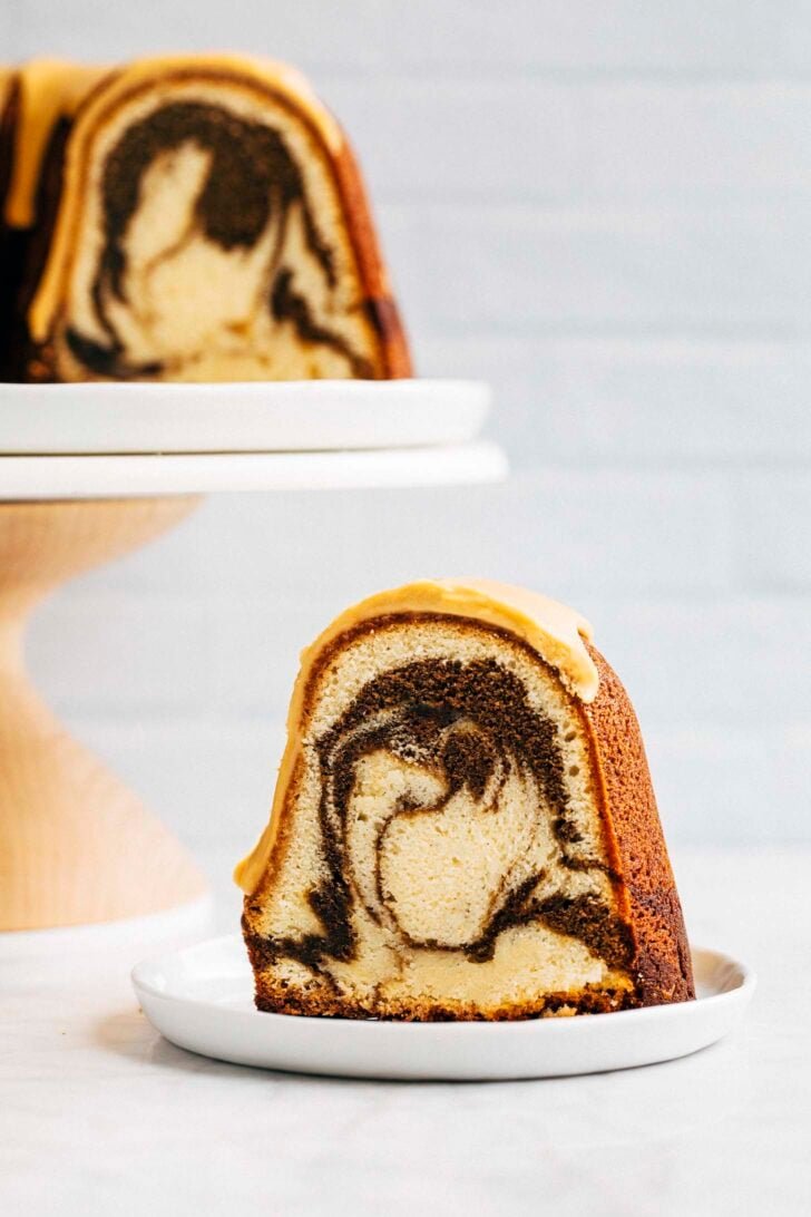 photo of a slice of vietnamese coffee bundt cake on a small white plate