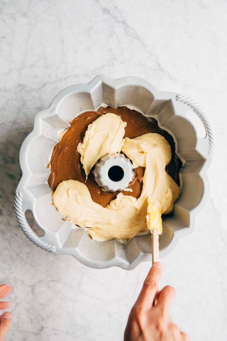 photo of michelle pouring more condensed milk on top of the coffee batter
