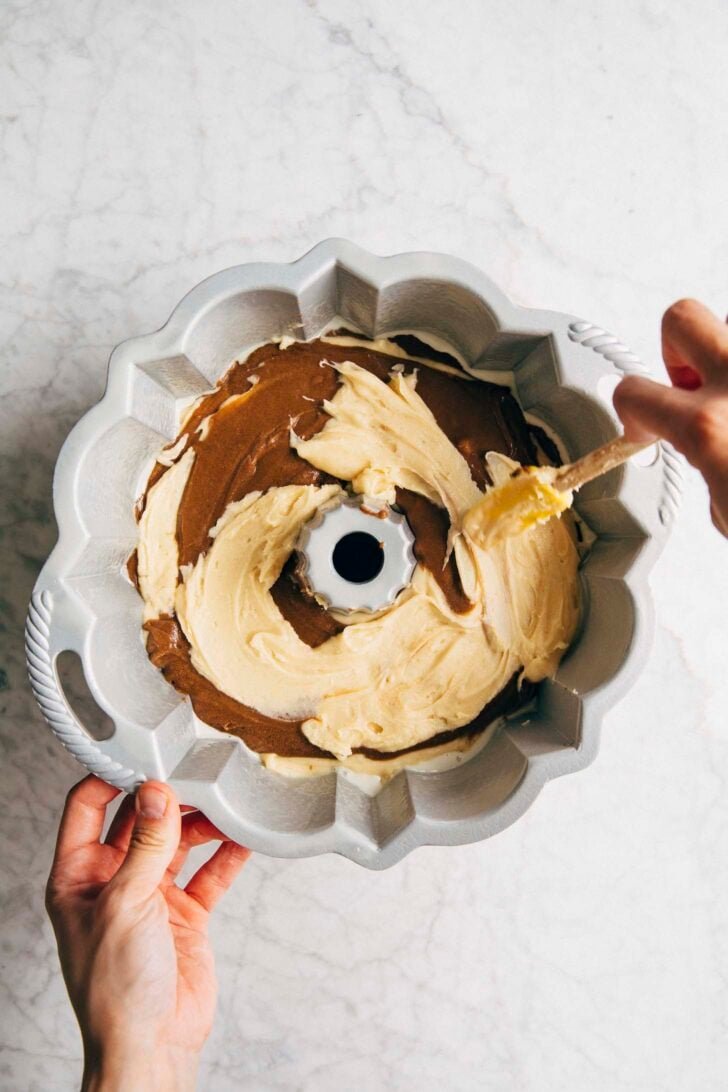 photo of michelle pouring the last layer of condensed milk batter for the vietnamese coffee bundt cake