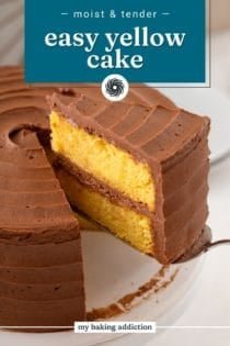 Cake server lifting a slice of easy yellow layer cake topped and filled with chocolate frosting. Text overlay includes recipe name.