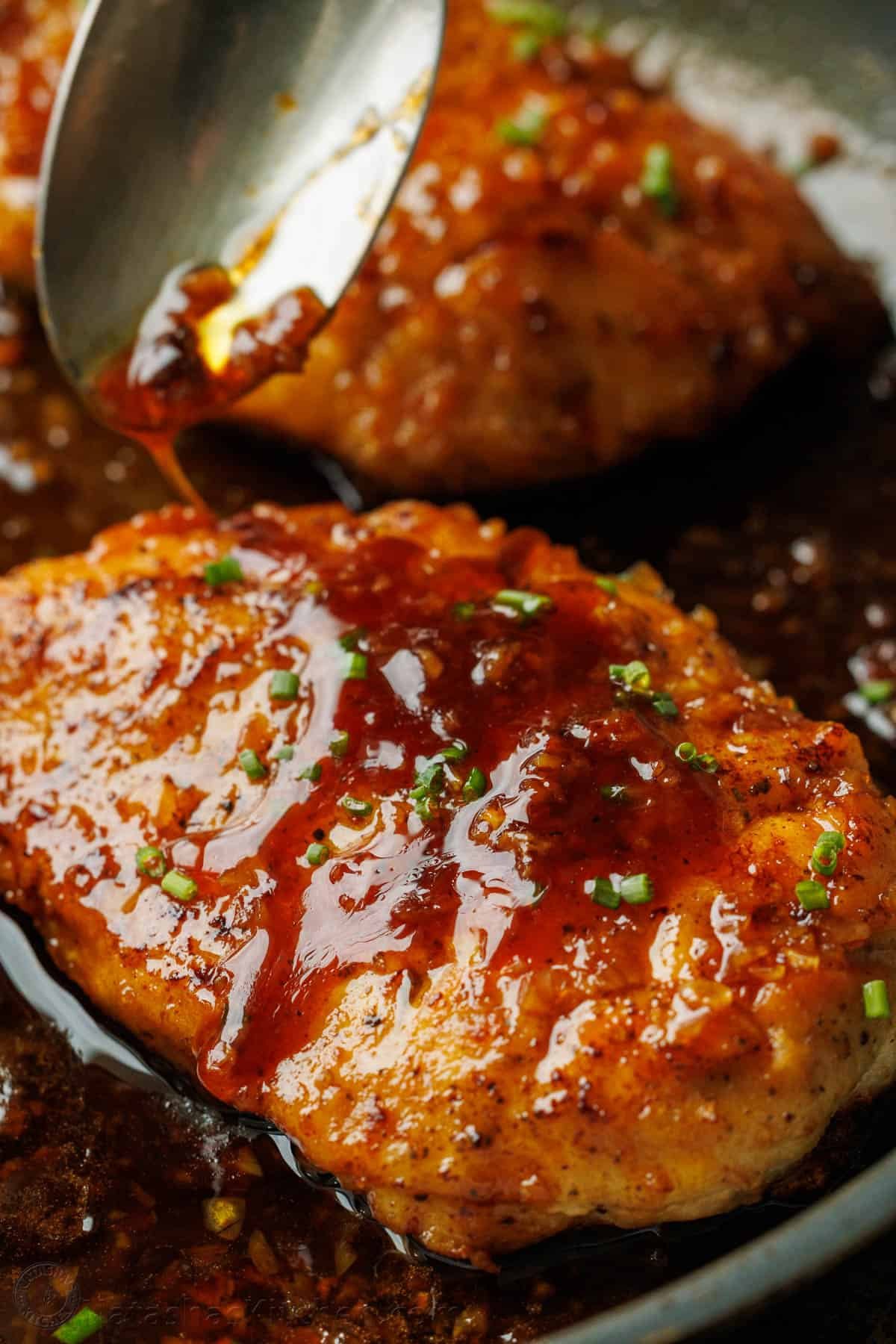 sauce poured over meat in a saute pan