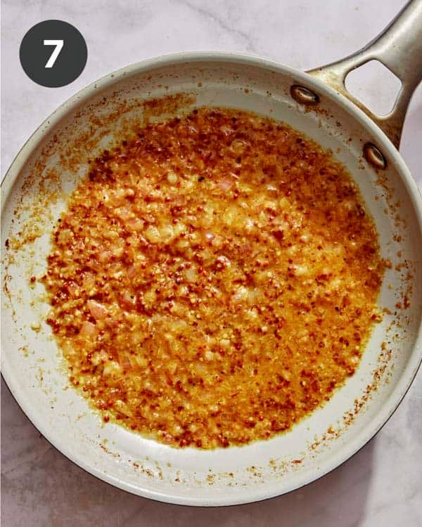 Cream sauce base simmering in a skillet. 