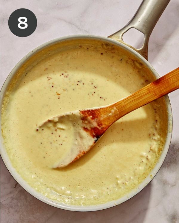 Cream sauce in a skillet simmering. 