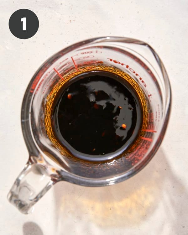 Yaki udon sauce wjisked together in a measuring cup. 