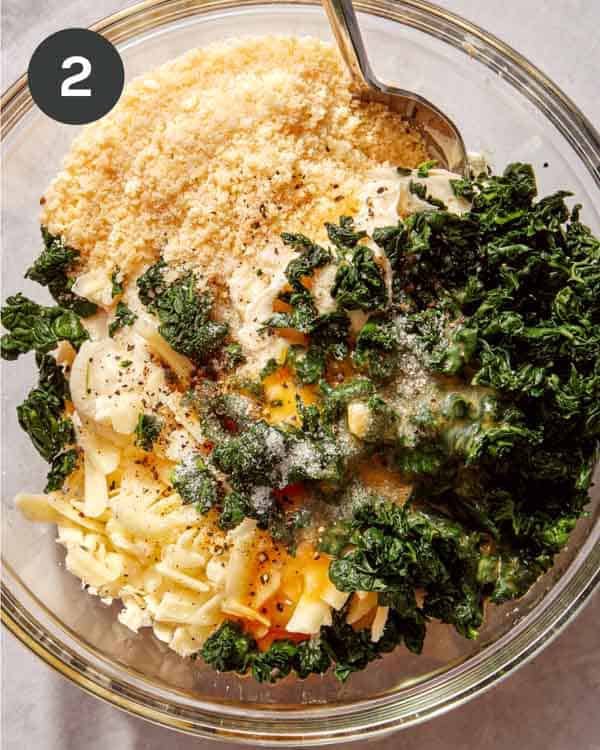 Ricotta mixture in a glass bowl with a spoon in it.