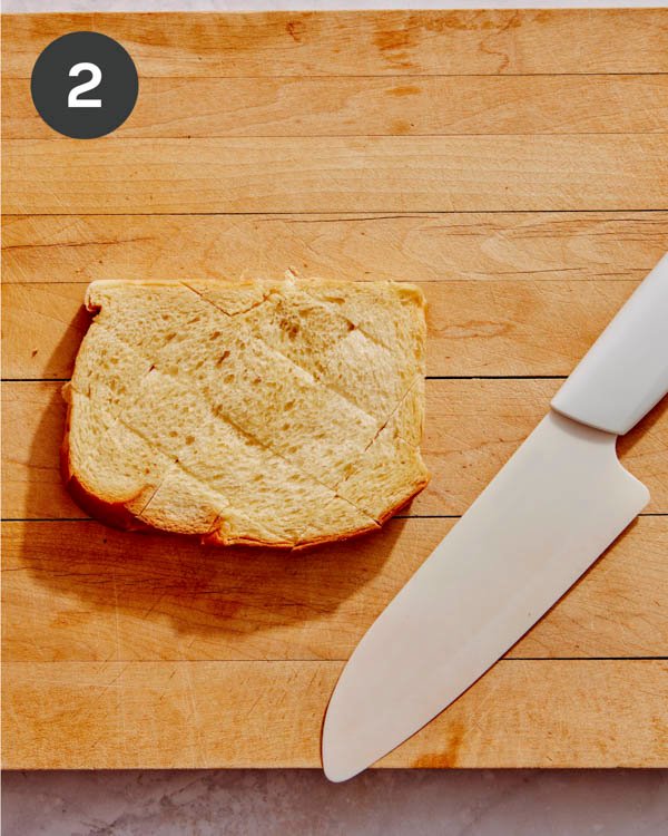 Brioche bread cut into sections partway down. 