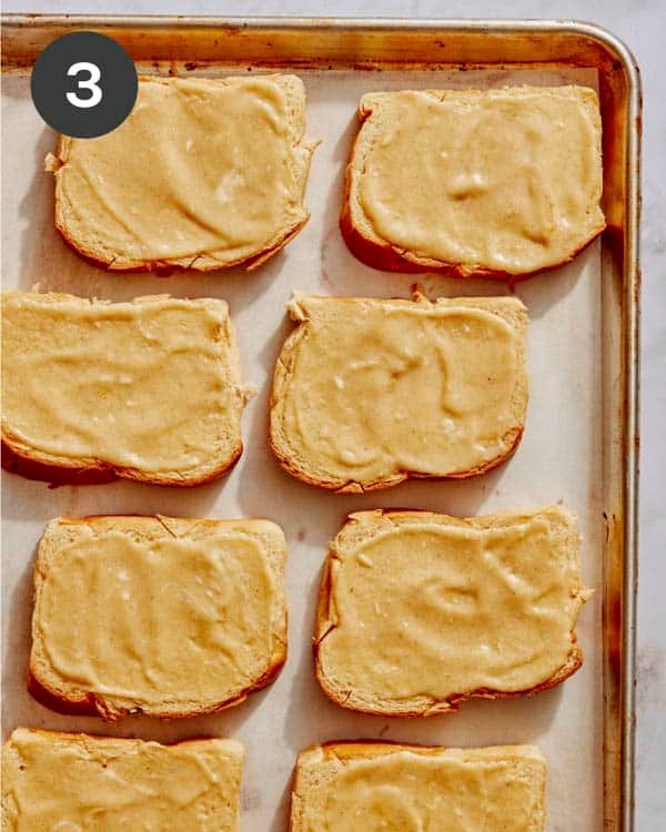Custard smeared on top of the brioche bread. 