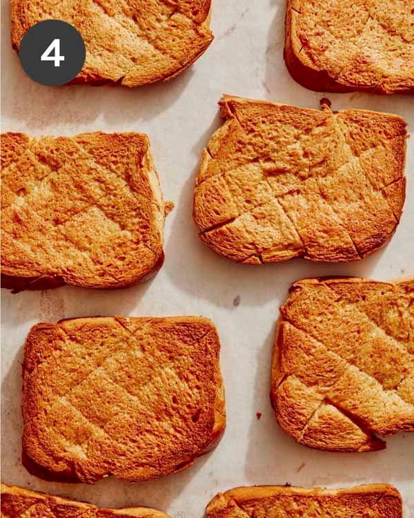Toasted honey toast on a baking sheet.