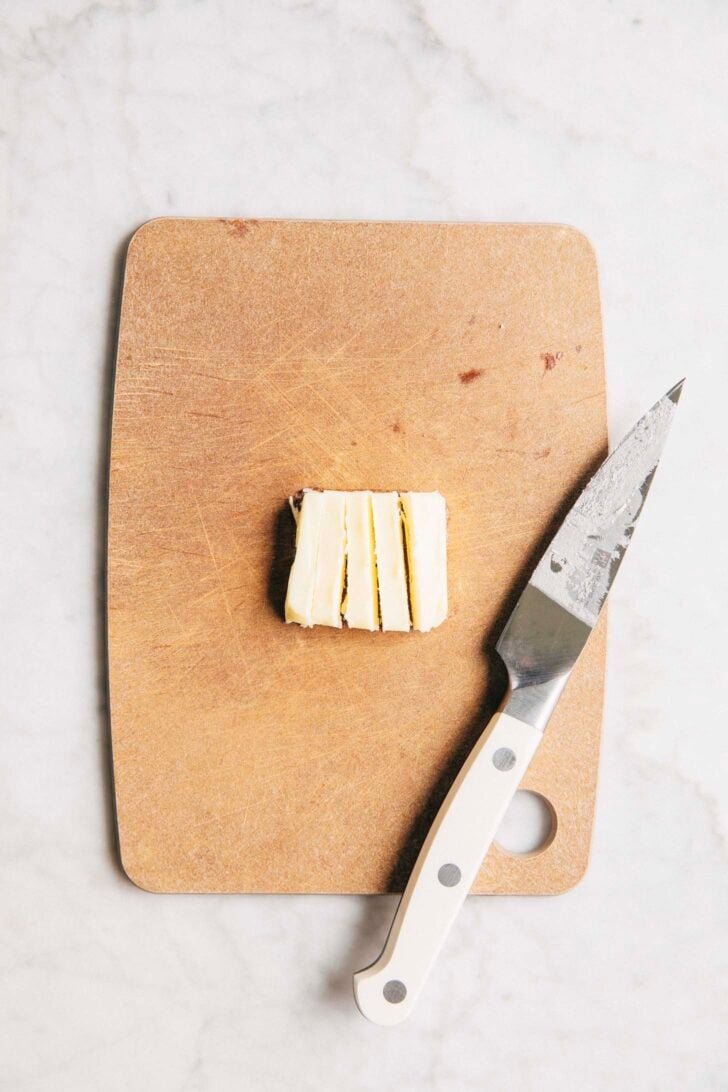Photo of Michelle cutting the butter square into long thin strips