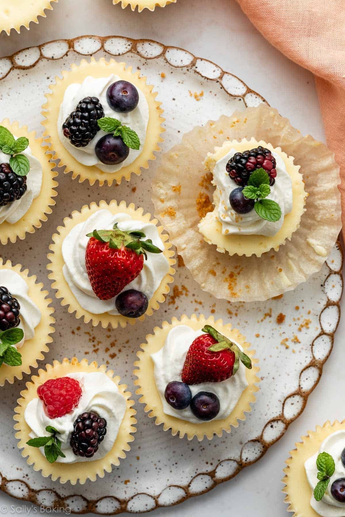mini cheesecakes with fresh berries and mint.