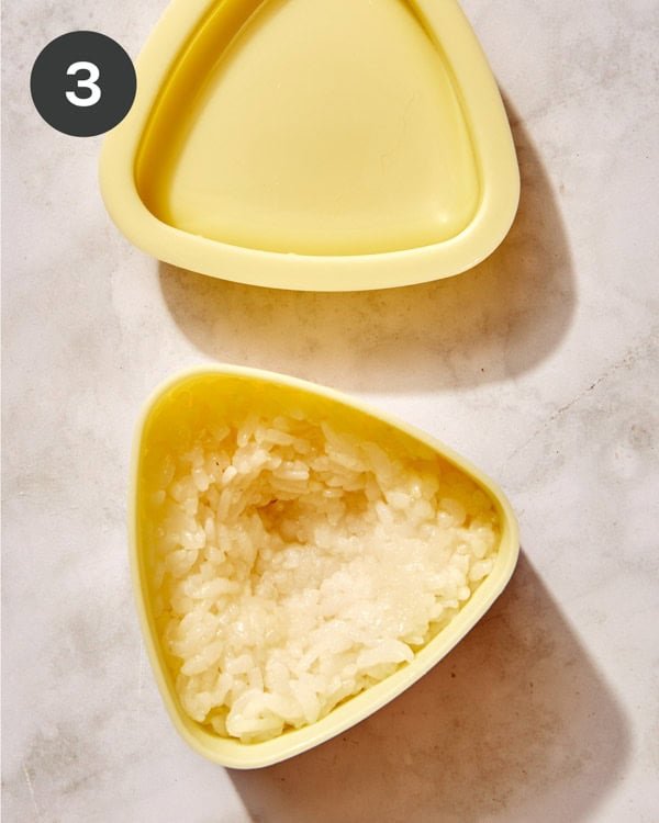 Rice in an onigiri mold.