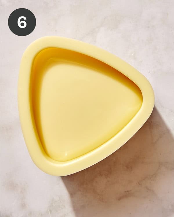 Tuna onigiri being pressed in a mold.