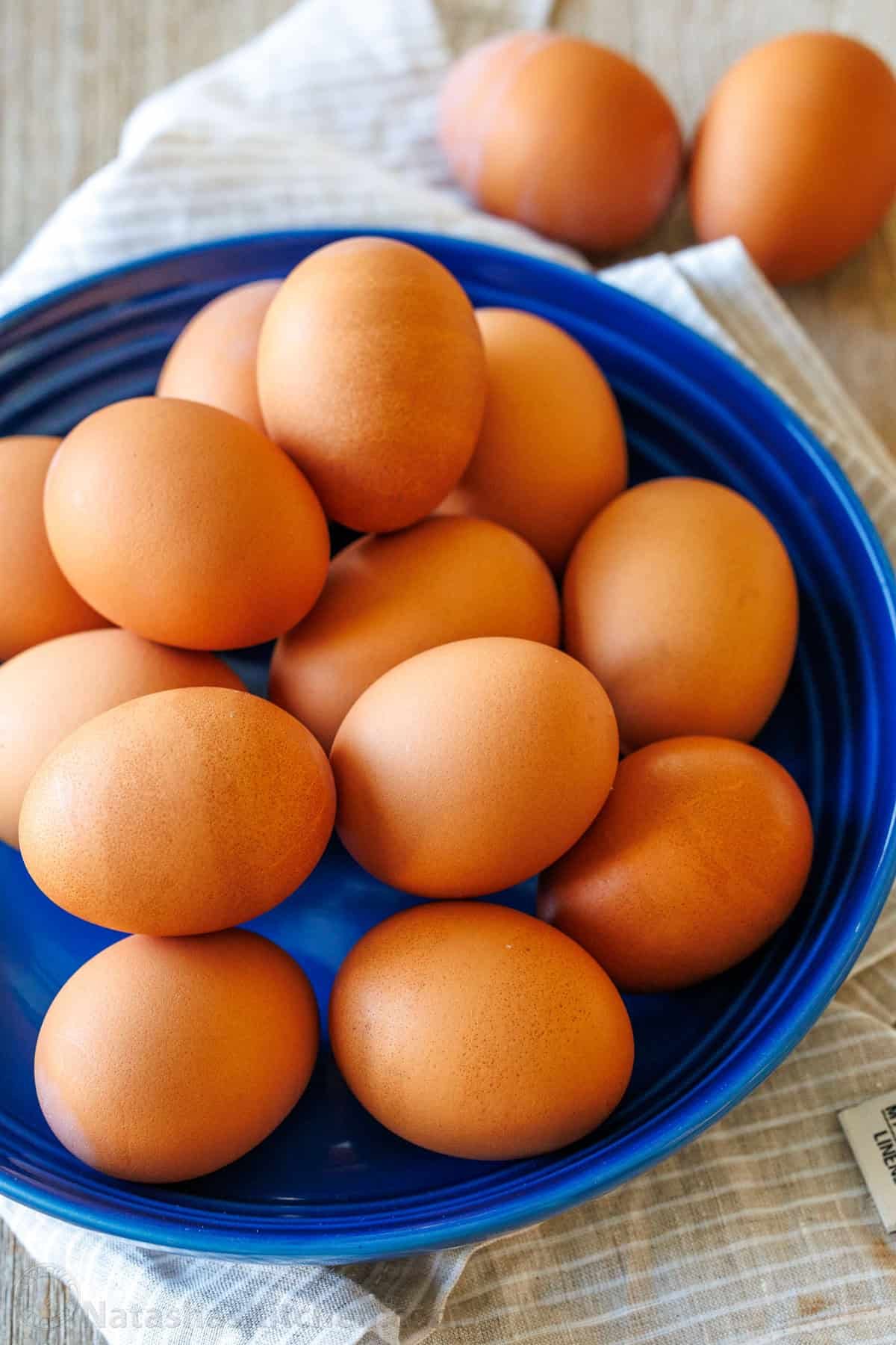 large plate of brown eggs on a blue plate