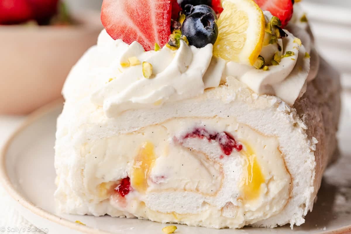 meringue roulade with fresh berries and lemon curd.