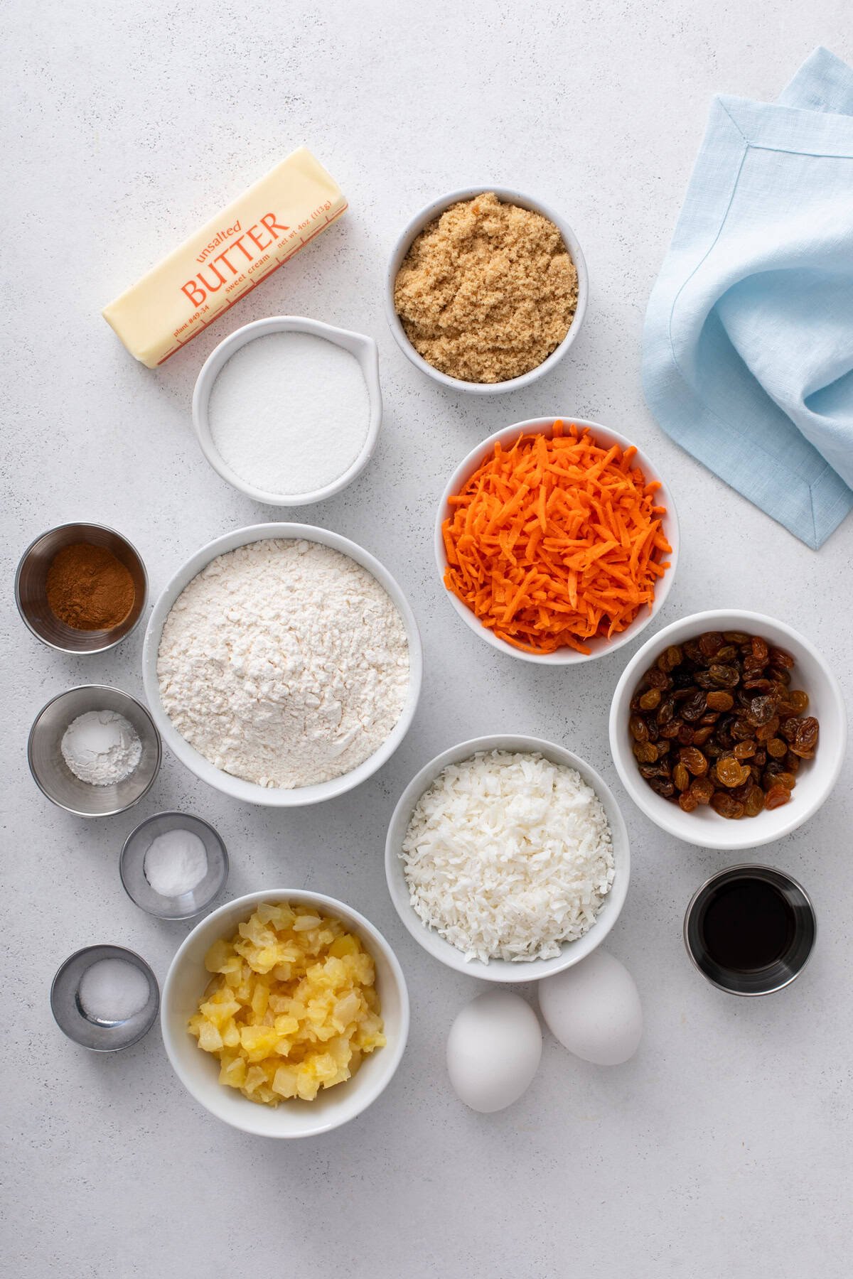 Ingredients for carrot cake cookies arranged on a countertop.