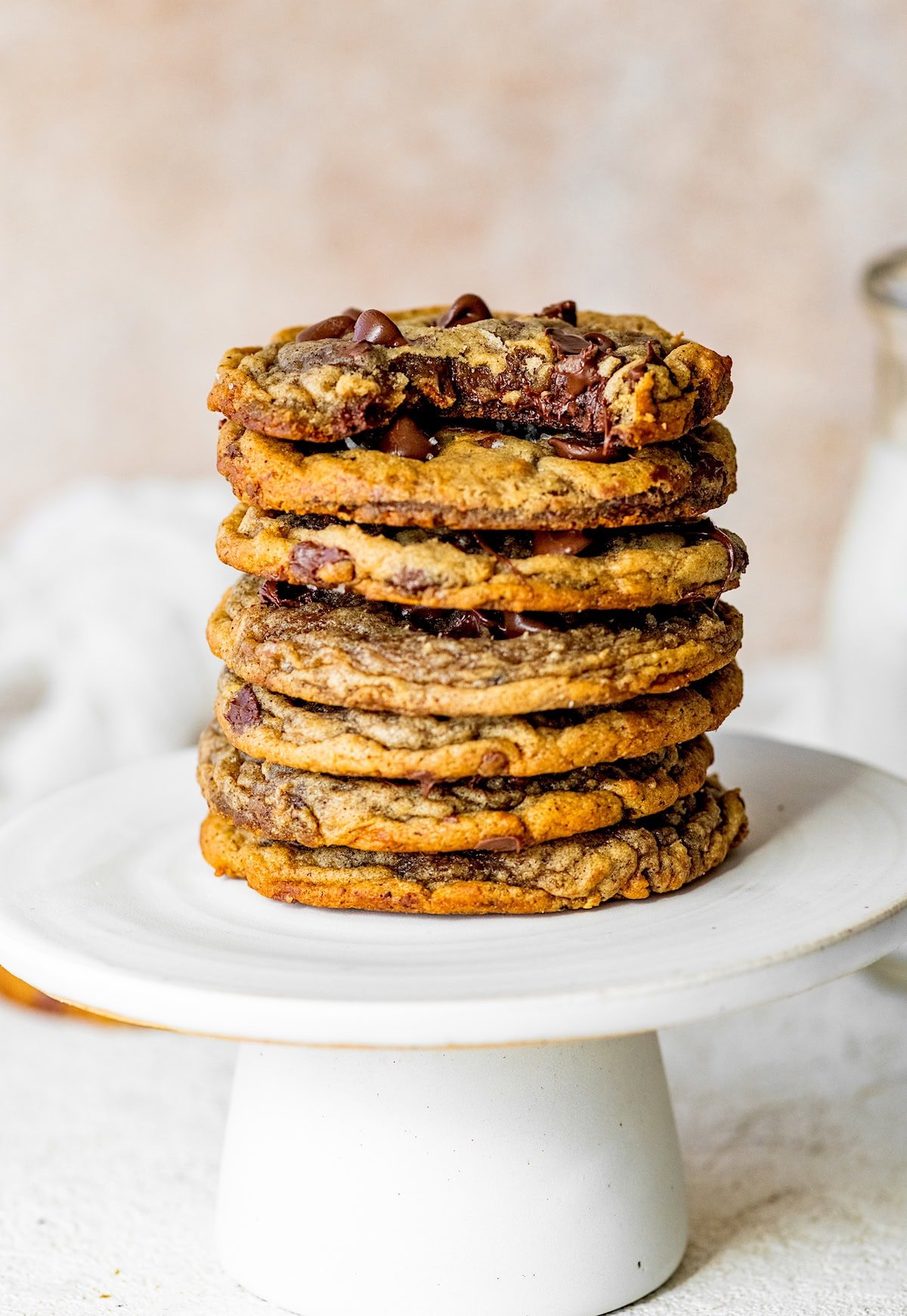 stack of banana bread chocolate chip cookies on cake stand. 