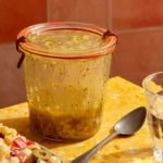 Italian vinaigrette recipe on a table in a jar.