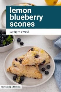 Two lemon blueberry scones on a white plate. Text overlay includes recipe name.