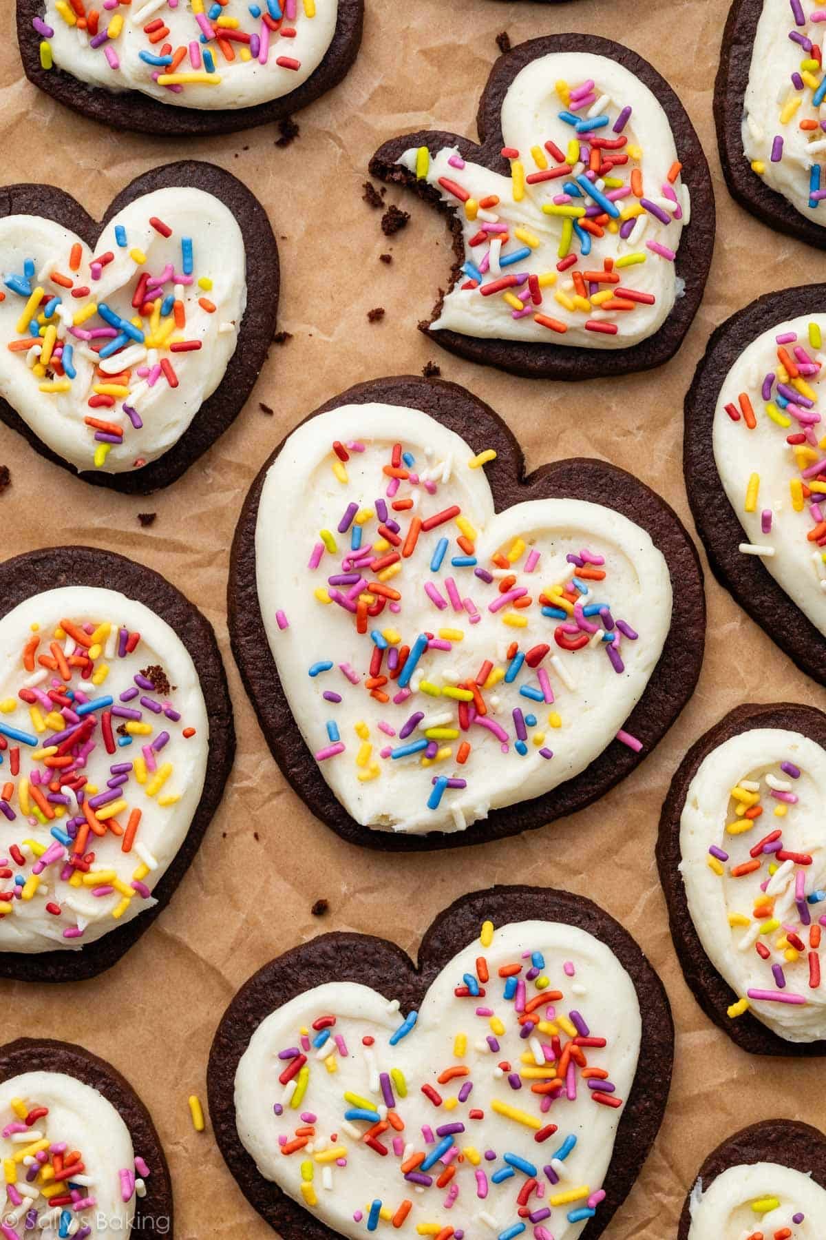 cut-out chocolate sugar cookies with buttercream and sprinkles.