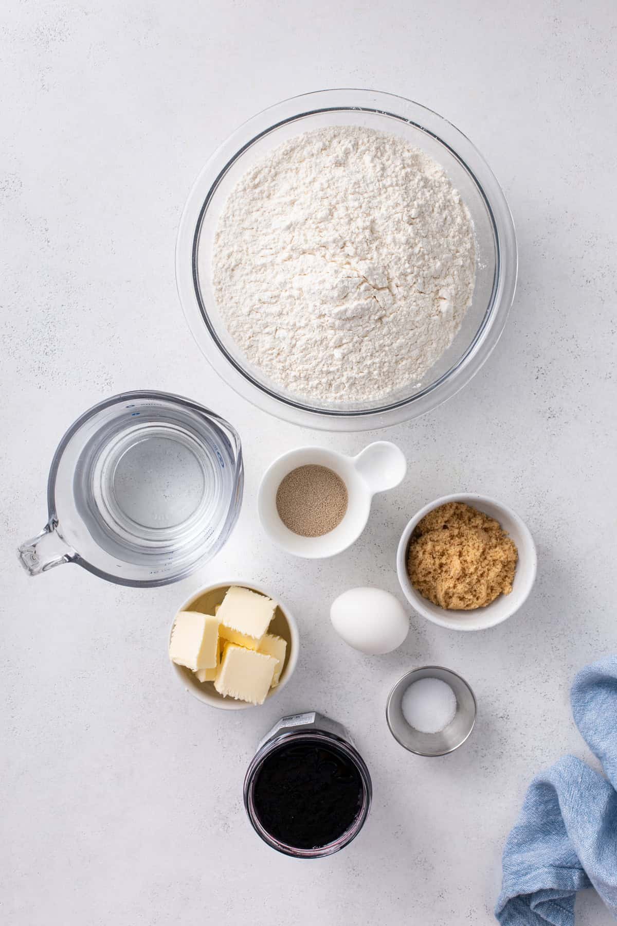 Ingredients for blueberry sweet rolls arranged on a countertop.