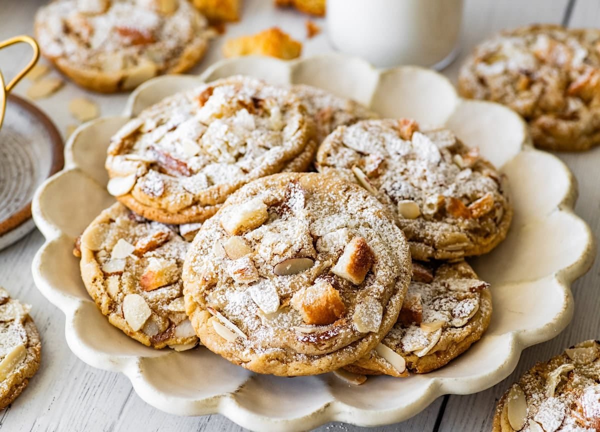 almond croissant cookies on scalloped plate. 