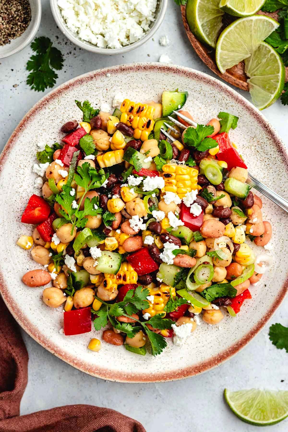 southwest bean salad on plate with fork. 