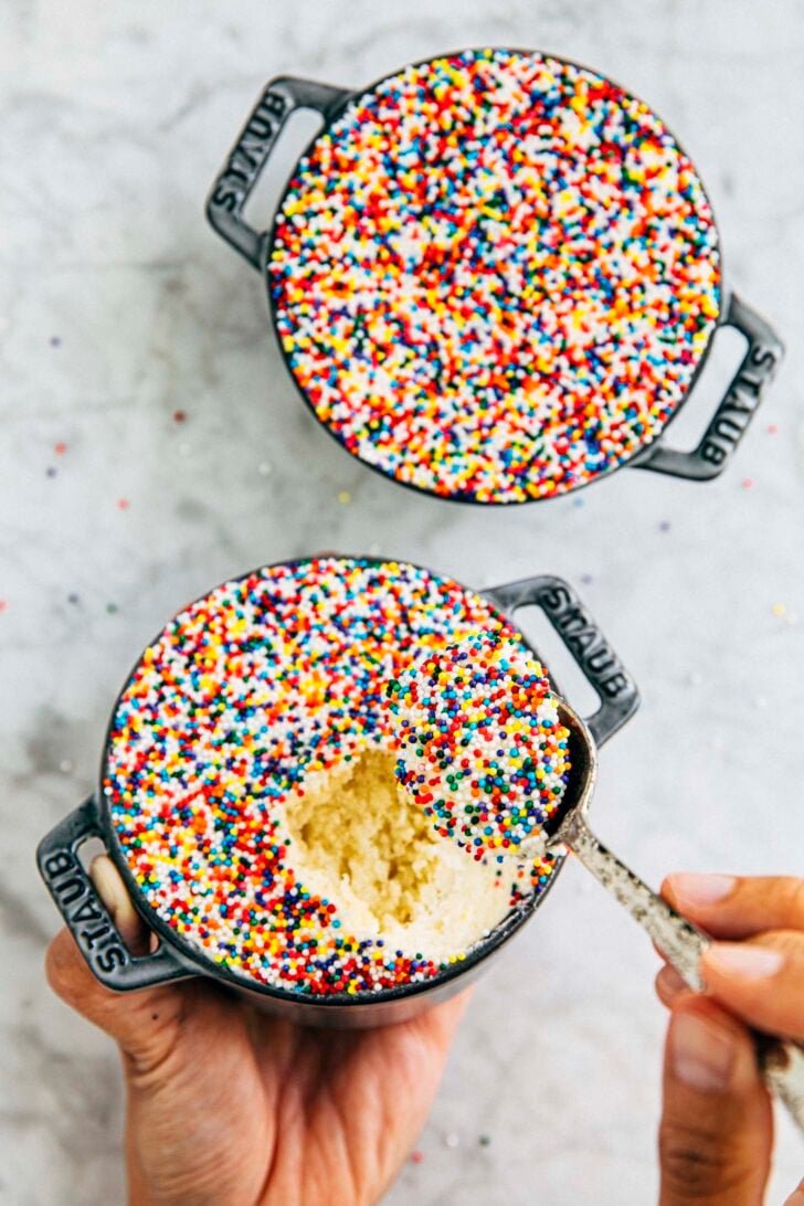 photo of two dot cakes with michelle from hummingbird high scooping out a bite from one