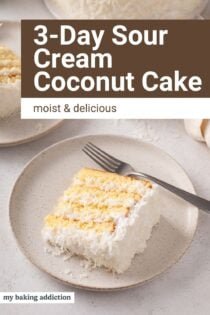 Plates of sour cream coconut cake on a countertop. Text overlay includes recipe name.