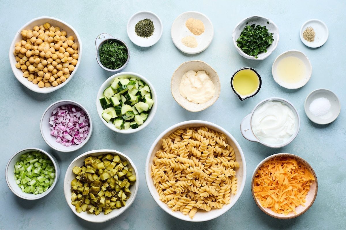 ingredients in bowls to make dill pickle pasta salad. 