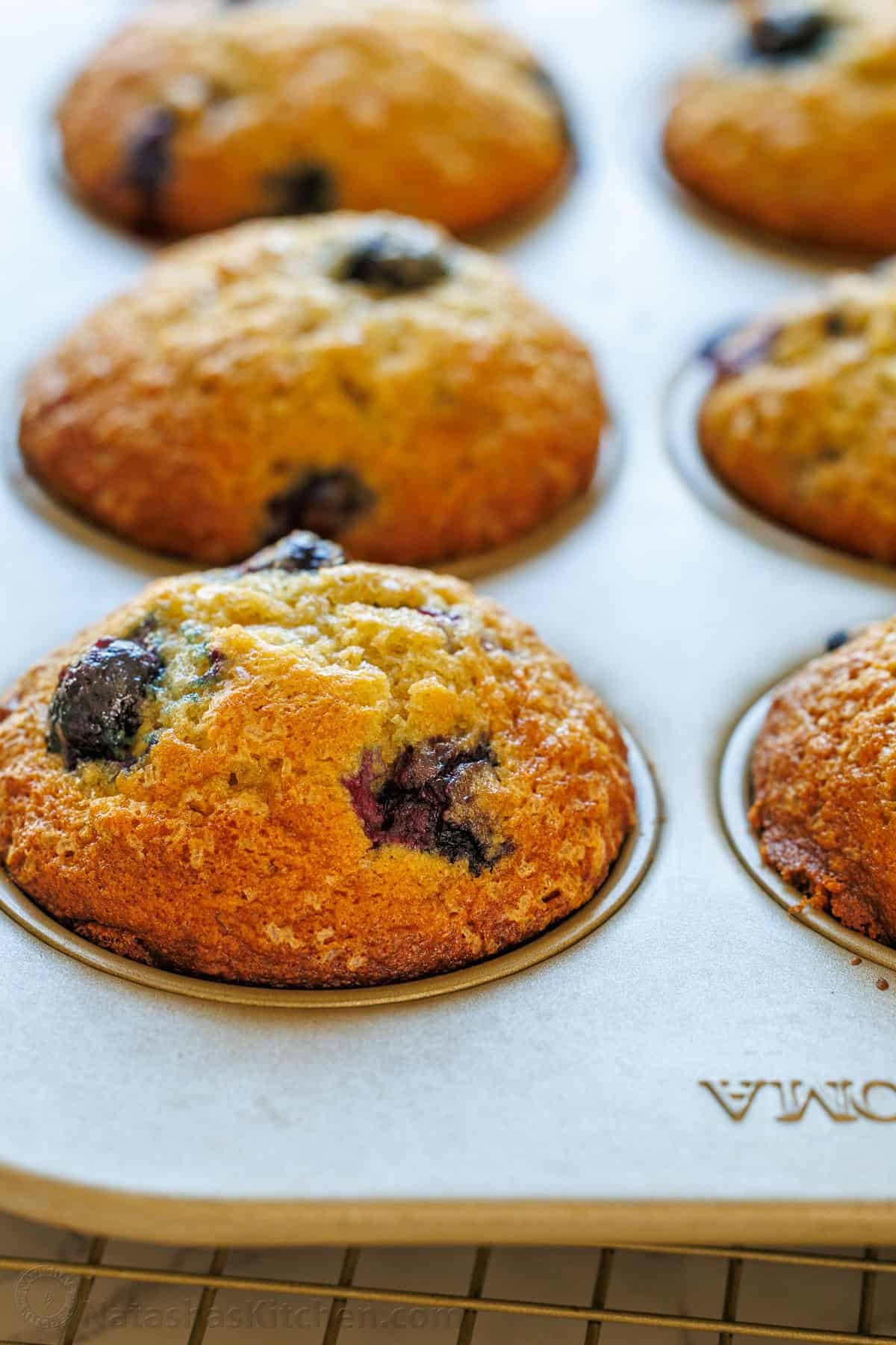 Large muffin tins with blueberry banana muffin recipe