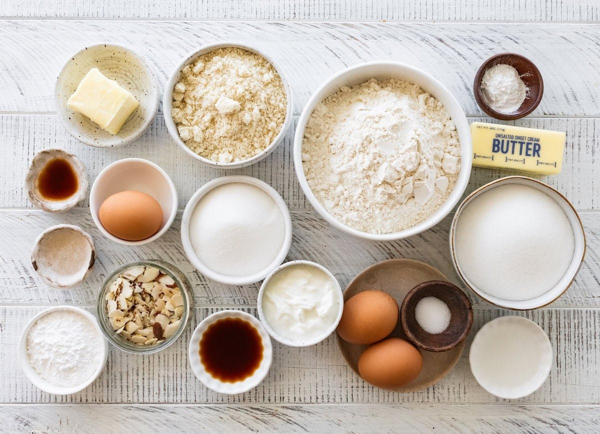 ingredients in bowls to make almond croissant muffins. 