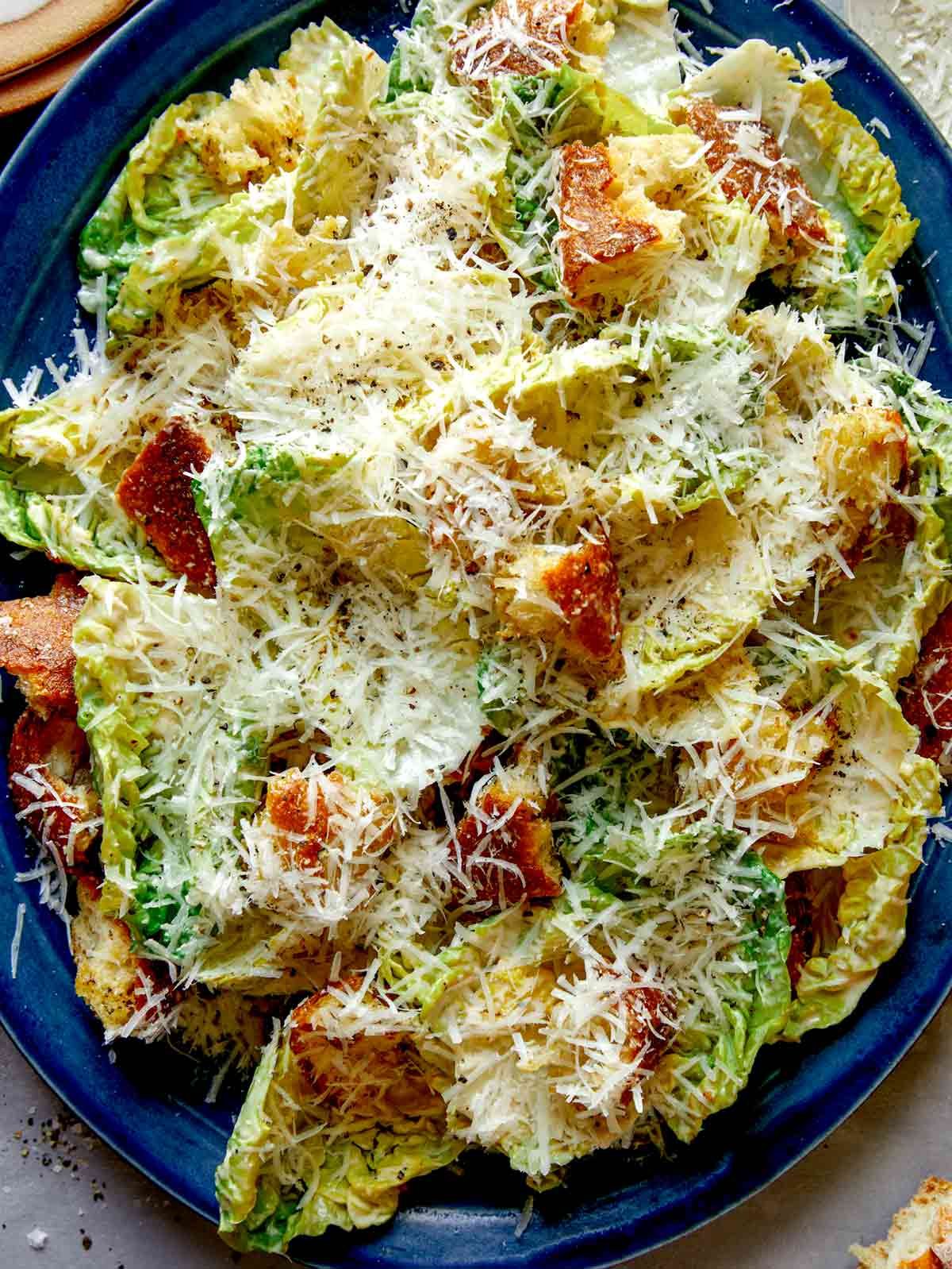 Close up on a platter full of caesar salad.