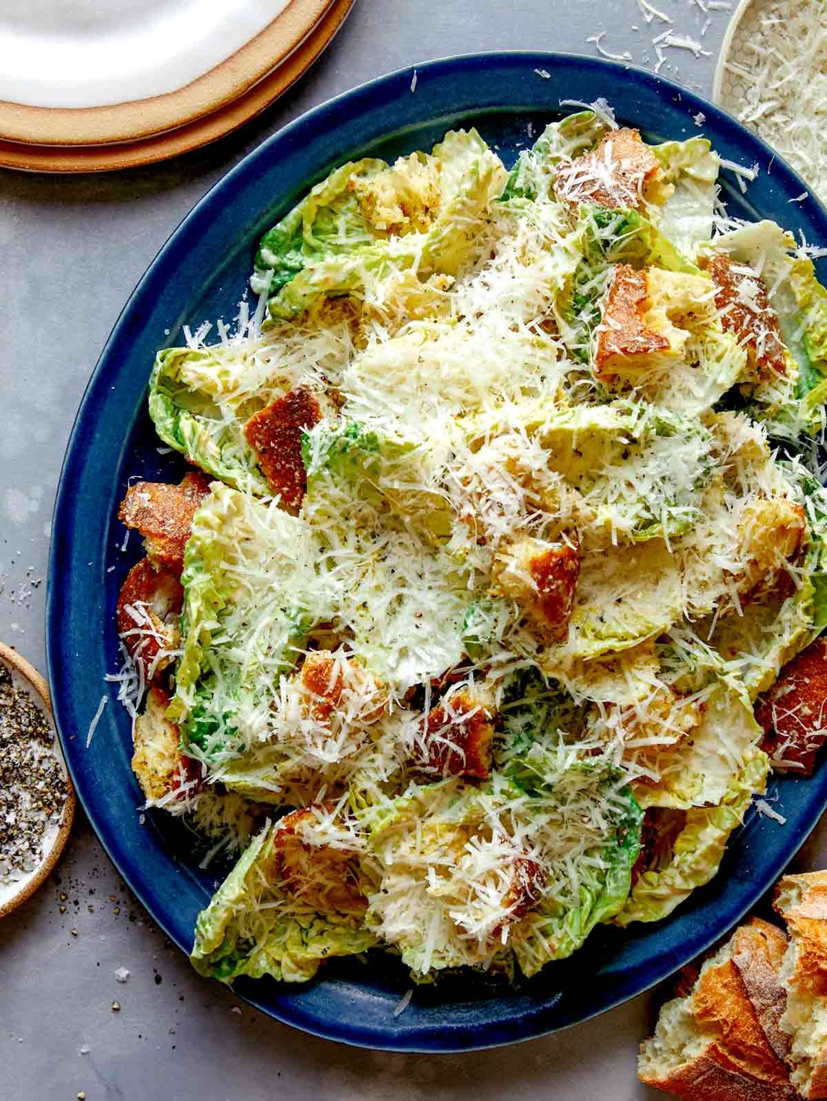 Caesar salad recipe on a platter.
