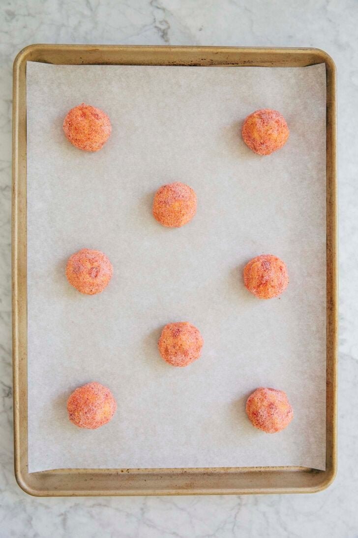 photo showing how to place the cookie dough balls in hopscotch formation on a baking tray