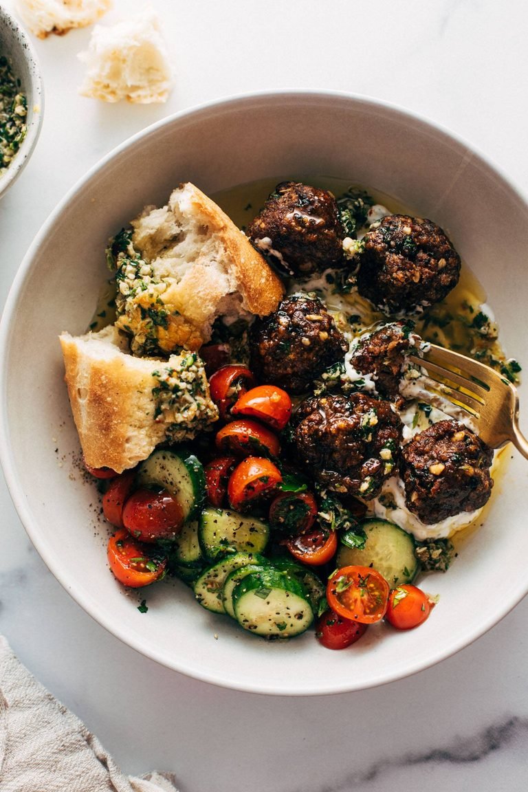 Sheet pan meatballs with tomato salad.