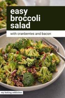 Close up of a fork in a bowl of broccoli cranberry salad. Text overlay includes recipe name.