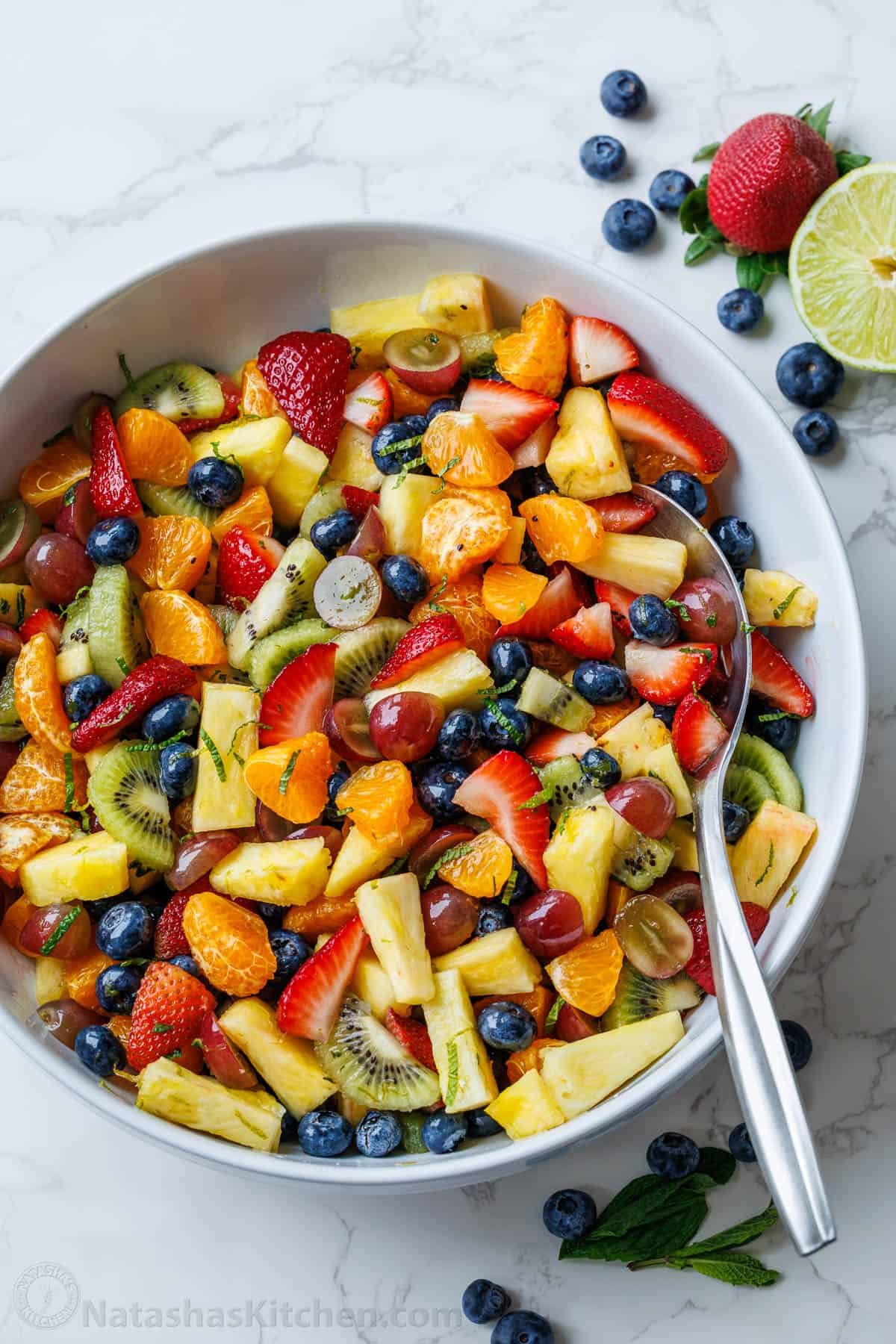 Classic Fruit Salad recipe features mixed fruit and a tasty honey-lime dressing. Bring this to your next potluck or gathering. Easy and fun!