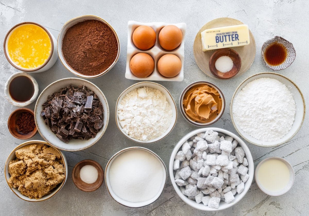 ingredients in bowls to make puppy chow brownies.