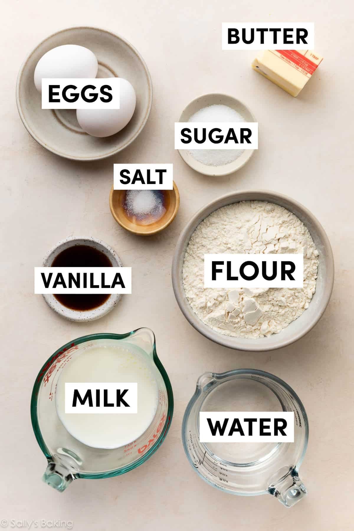 ingredients in bowls including flour, eggs, water, milk, sugar, and vanilla.