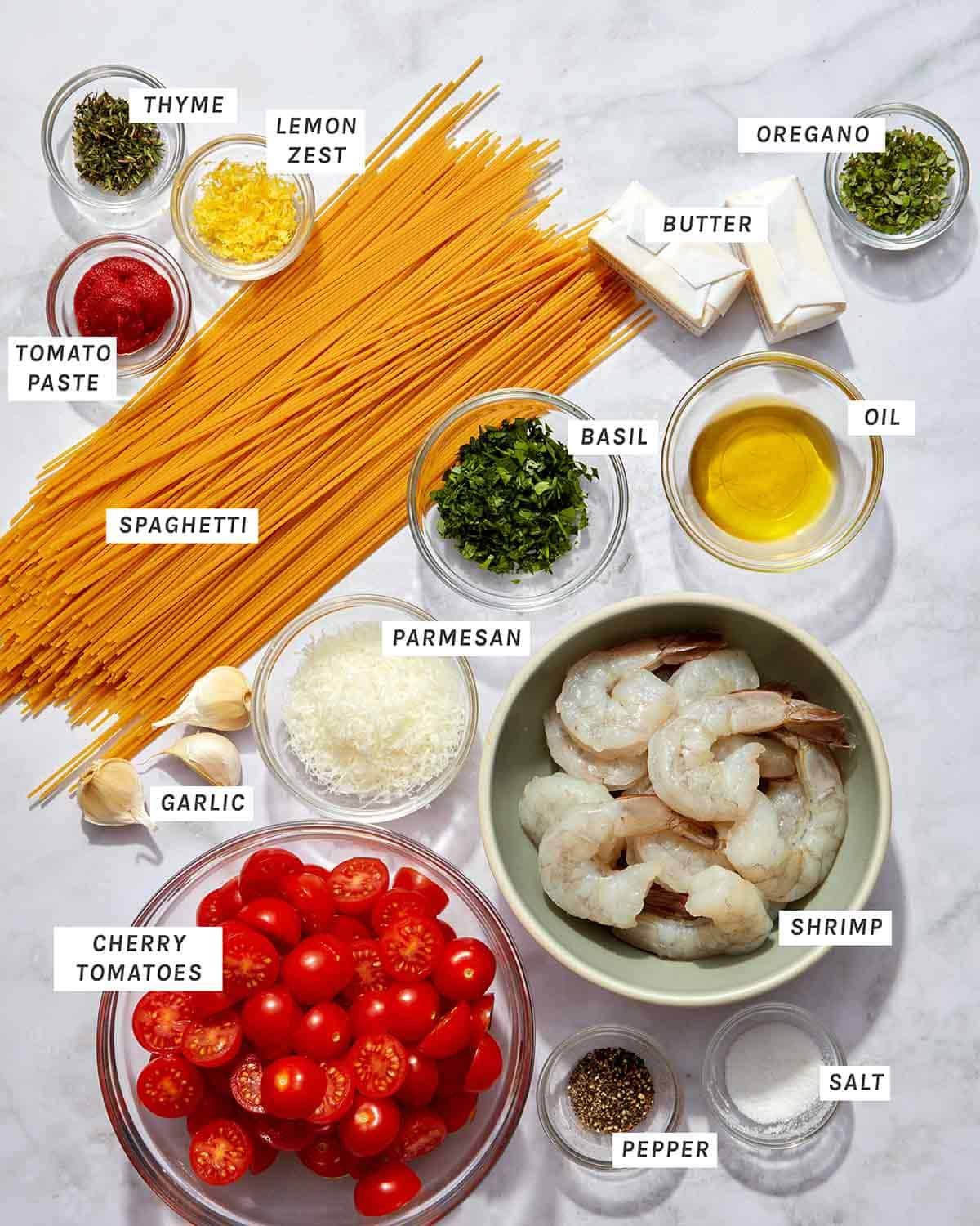 Measured ingredients for tomato butter pasta on a kitchen counter.