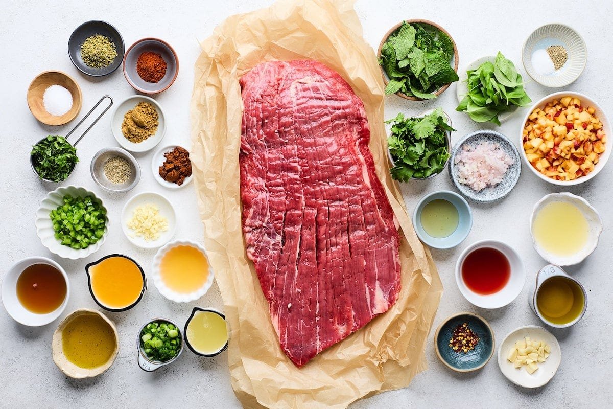 ingredients to make grilled steak with peach chimichurri. 