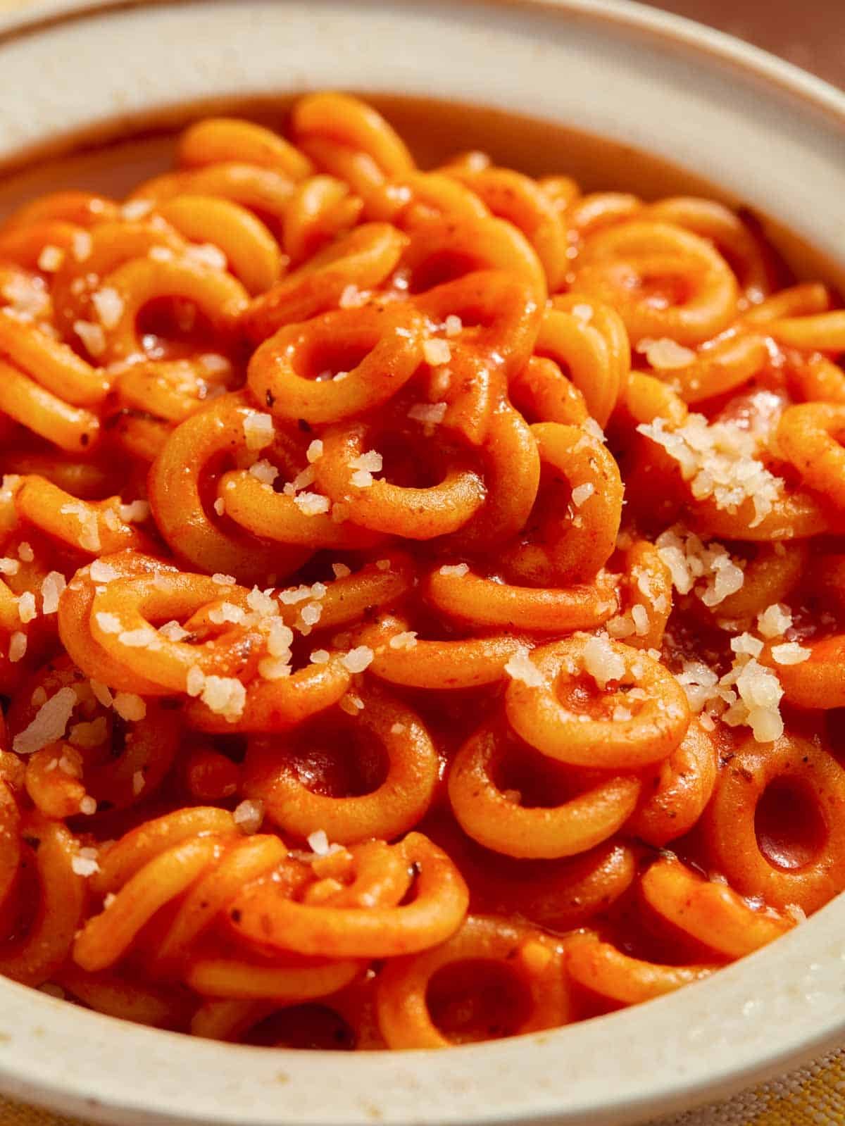 Up close on a bowl on homemade Spaghetti Os.