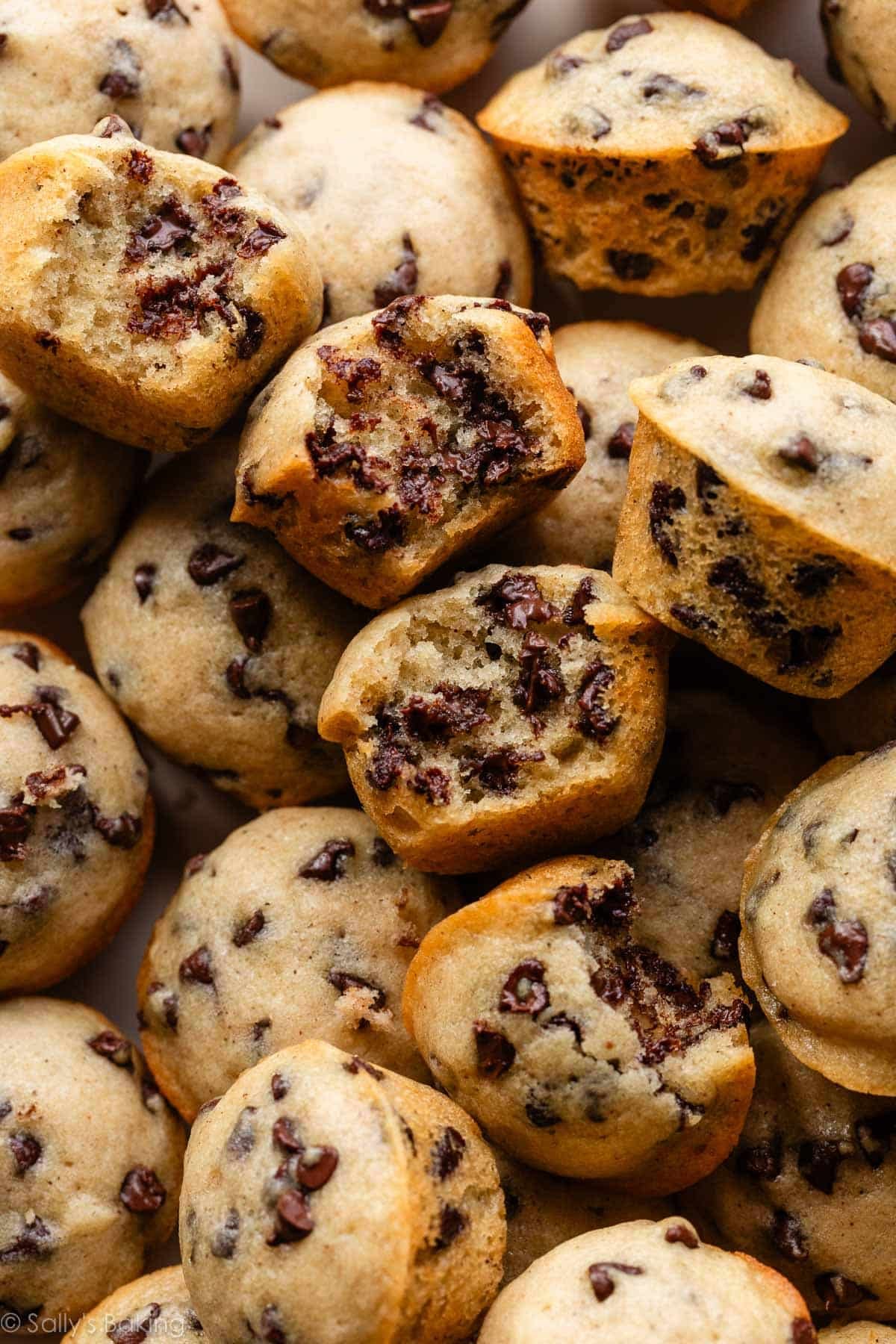 close-up image of mini chocolate chip muffins with bite taken out.