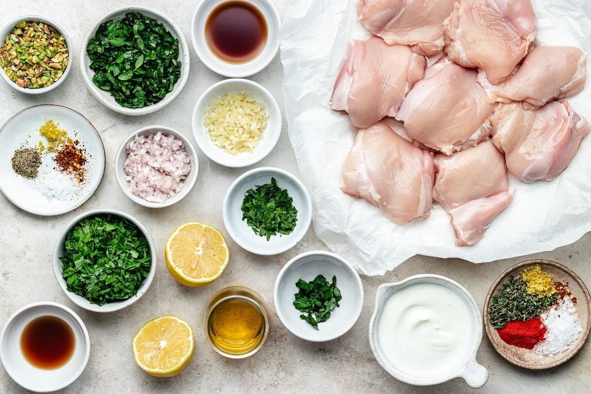 ingredients to make grilled lemon herb chicken thighs with pistachio chimichurri. 