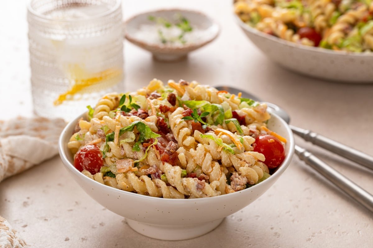 Serving of BLT pasta salad in a small white bowl.