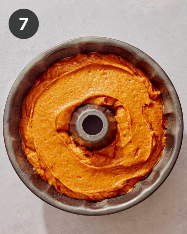 Pumpkin cake batter in a bundt pan.